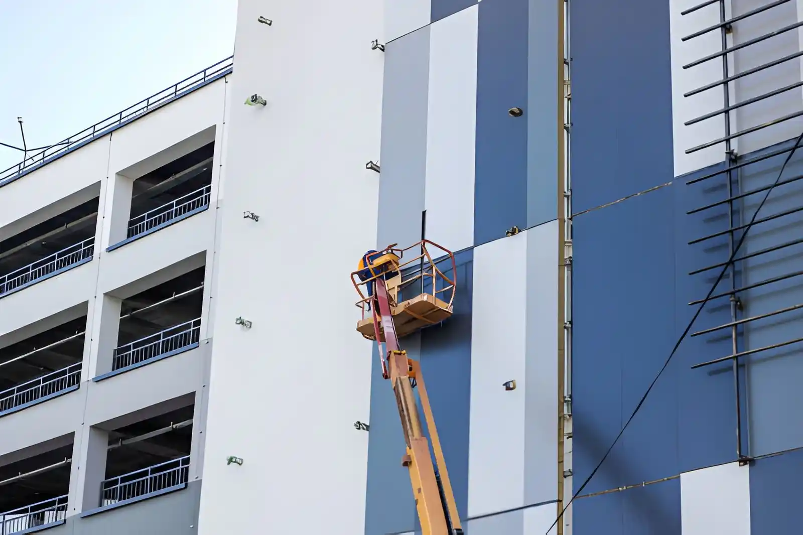 Top Renovations team member completing an industrial painting project