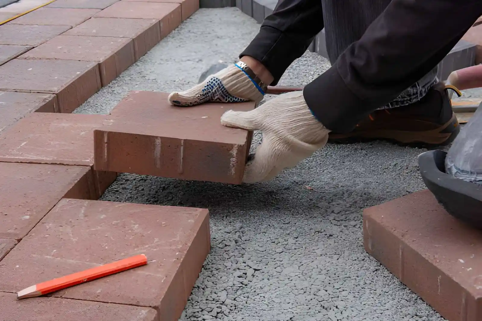 Paving contractor installing blocks on a prepared base in Dublin